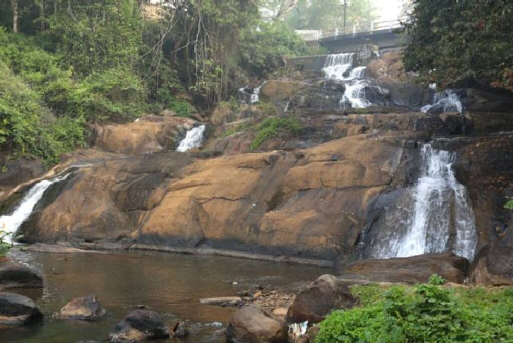 Admire the Aruvikuzhi Waterfall