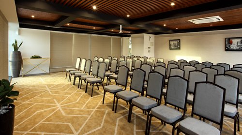 Modern conference hall at Sugar Business Hotel featuring Twelve Tables executive meeting space with elegant interiors and business-friendly facilities.