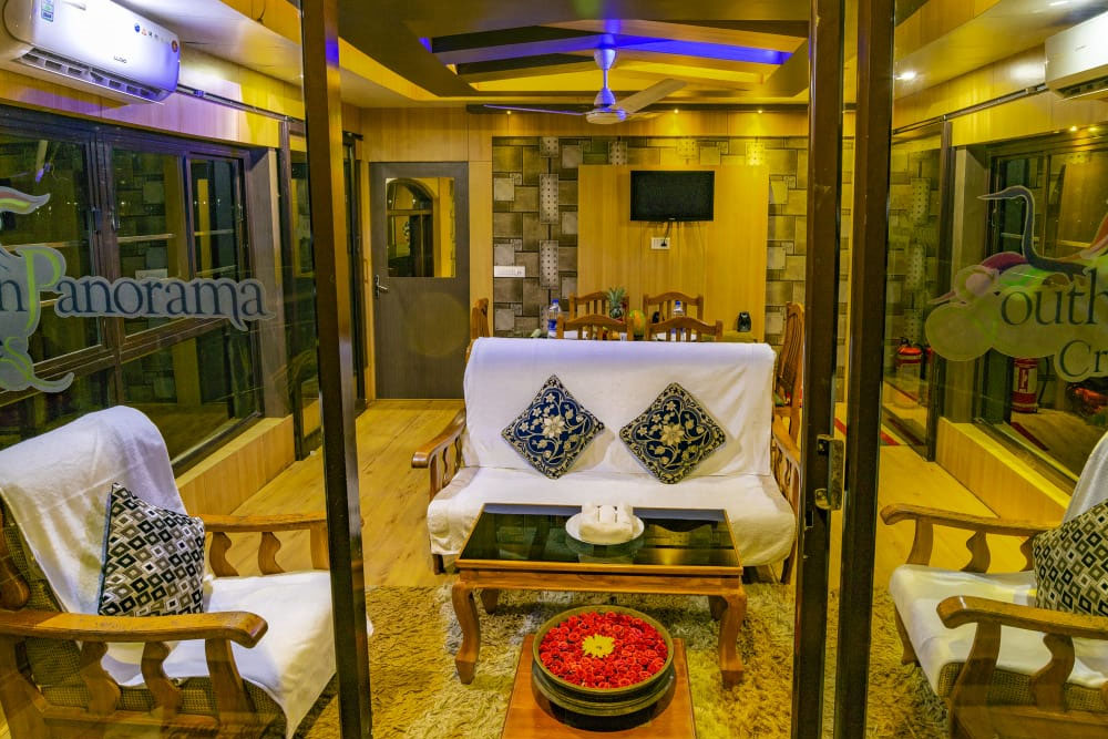 Luxurious Southern Panorama houseboat cruising through the serene Alleppey backwaters on Vembanad Lake with modern amenities and traditional Kerala design.